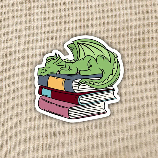 DRAGON SLEEPING ON PILE OF BOOKS STICKER